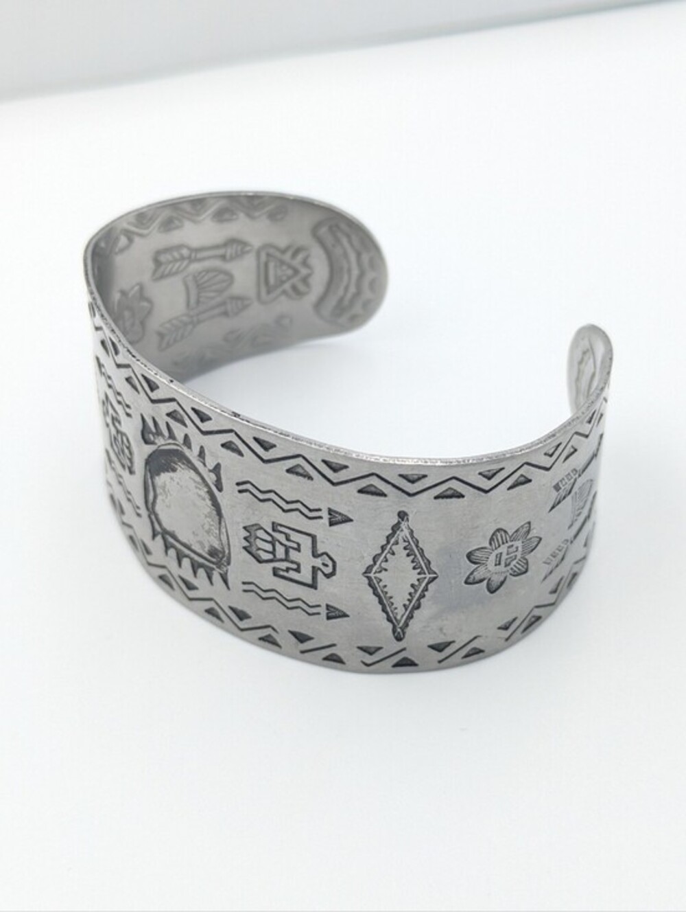 Vintage silver tone engraved symbol cuff bracelet